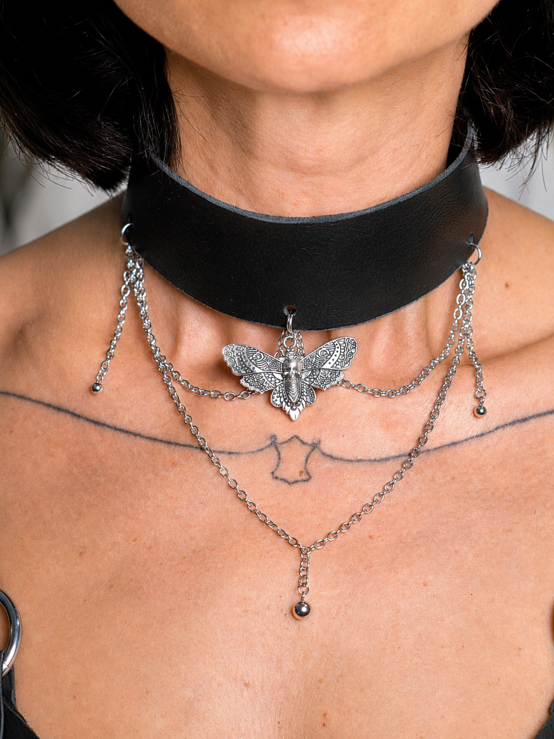 Wide leather choker with butterfly pendant